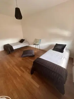 Un ou plusieurs lits dans un hébergement de l'établissement Appartement spacieux