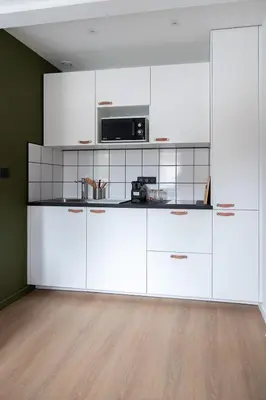 Cuisine ou kitchenette dans l'établissement Résidence Mariotte - Le Bleu Majorelle - Appartement indépendant