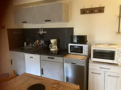 Cuisine ou kitchenette dans l'établissement Charming and peaceful Appartement des Rosiers