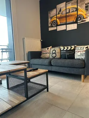 Coin salon dans l'établissement T2 Luxe 50m2 Porte de Dijon Wifi Fibre Smart TV