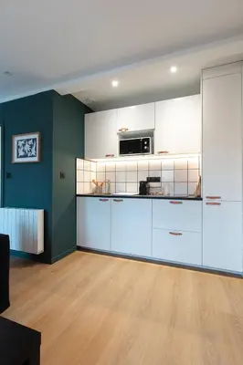 Cuisine ou kitchenette dans l'établissement Résidence Mariotte - Le Gris Ardoise - Appartement Indépendant