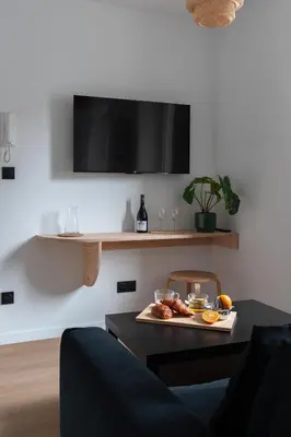 Télévision ou salle de divertissement dans l'établissement Résidence Mariotte - Le Gris Ardoise - Appartement Indépendant