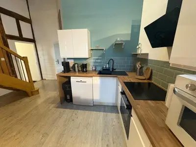 Cuisine ou kitchenette dans l'établissement L Experience Bressane 2
