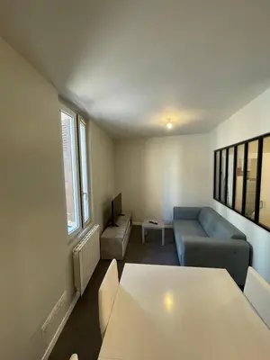 Un ou plusieurs lits dans un hébergement de l'établissement Apartment with terrace and barbecue Hyper center