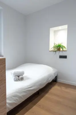 Un ou plusieurs lits dans un hébergement de l'établissement Résidence Mariotte - Le vert Kaki - Appartement Indépendant
