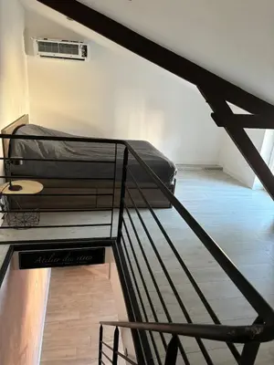 Un ou plusieurs lits dans un hébergement de l'établissement Maison f2 avec cour privative