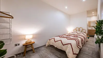 Un ou plusieurs lits dans un hébergement de l'établissement Boheme Appart Cosy Centre Dijon