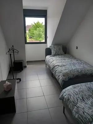 Un ou plusieurs lits dans un hébergement de l'établissement Chambres d'hôtes bord de Saône