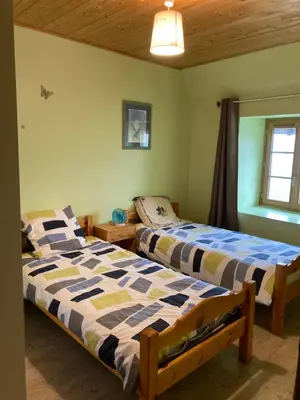 Un ou plusieurs lits dans un hébergement de l'établissement Maison à la campagne