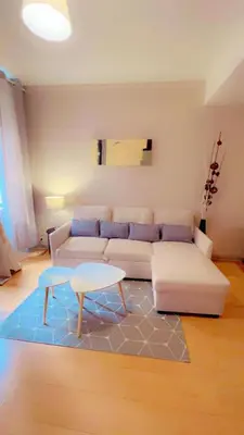 Coin salon dans l'établissement Api Appartement
