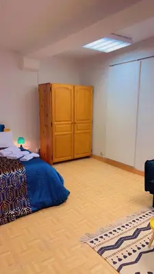 Un ou plusieurs lits dans un hébergement de l'établissement Api Appartement