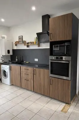 Cuisine ou kitchenette dans l'établissement Appartement cosy 6 places