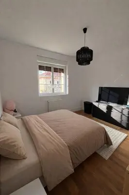 Un ou plusieurs lits dans un hébergement de l'établissement Appartement cosy 6 places