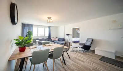 Coin salon dans l'établissement Appartement 3 chambres - Chalon