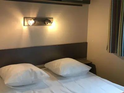 Un ou plusieurs lits dans un hébergement de l'établissement Mobil Home avec Terrasse à Saint-Boil pour 6 personnes - API-1-52-1145