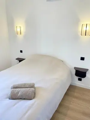 Un ou plusieurs lits dans un hébergement de l'établissement Appartement au pied des vignes avec terrasse