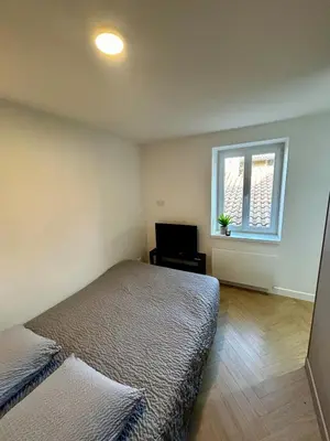 Un ou plusieurs lits dans un hébergement de l'établissement Studio centre village