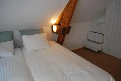 Un ou plusieurs lits dans un hébergement de l'établissement Maison Le Feu Follet