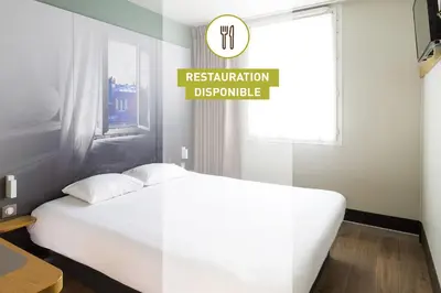 Un ou plusieurs lits dans un hébergement de l'établissement B&B HOTEL BEAUNE Nord