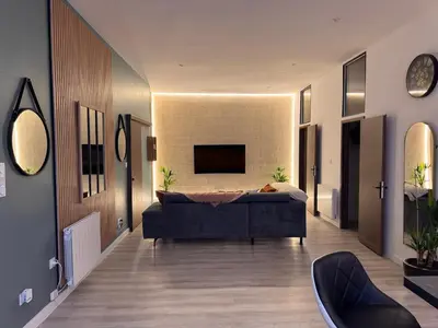 Télévision ou salle de divertissement dans l'établissement HOME 102 Cosy