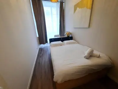 Un ou plusieurs lits dans un hébergement de l'établissement L'Auguste, Appartement Lumineux & Central