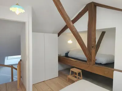 Un ou plusieurs lits dans un hébergement de l'établissement Maison Spacieuse et Lumineuse