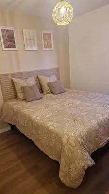 Un ou plusieurs lits dans un hébergement de l'établissement Le Cosy 209 des Logis de Paray Studio Downtown