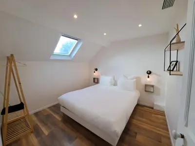 Un ou plusieurs lits dans un hébergement de l'établissement Maison spacieuse climatisée, spa et pétanque pour 6 pers