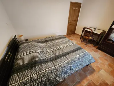 Un ou plusieurs lits dans un hébergement de l'établissement La maison bleue