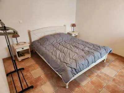 Un ou plusieurs lits dans un hébergement de l'établissement La maison bleue