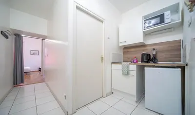 Cuisine ou kitchenette dans l'établissement Le Jean Moulin 1