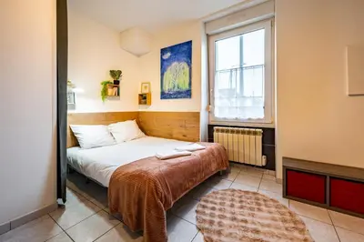 Un ou plusieurs lits dans un hébergement de l'établissement La Rose Des Vents - Parking Gratuit - StyleCosy