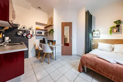 Cuisine ou kitchenette dans l'établissement La Rose Des Vents - Parking Gratuit - StyleCosy
