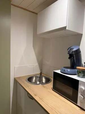 Cuisine ou kitchenette dans l'établissement Le petit cocon de Jeannin