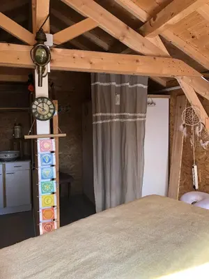 Un ou plusieurs lits dans un hébergement de l'établissement Gîte A l 'Ombre des Acacias