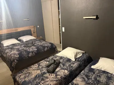 Un ou plusieurs lits dans un hébergement de l'établissement Hôtel du Centre