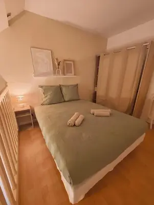 Un ou plusieurs lits dans un hébergement de l'établissement Le Nid de la Chouette - Dijon Historic Center