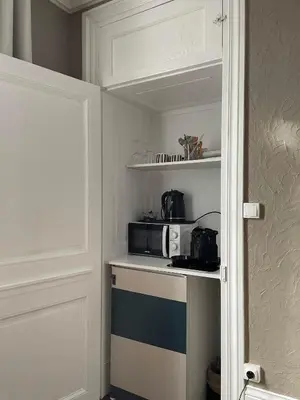 Cuisine ou kitchenette dans l'établissement La Chambre d'Adèle