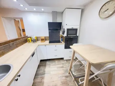 Cuisine ou kitchenette dans l'établissement Appartement Cosy terrasse