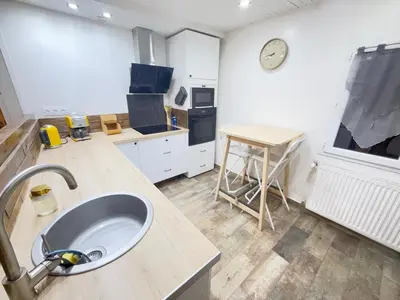Cuisine ou kitchenette dans l'établissement Appartement Cosy terrasse