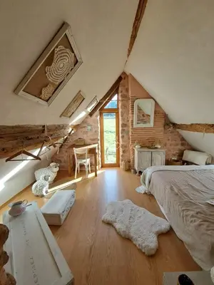 Un ou plusieurs lits dans un hébergement de l'établissement Maison la Bambine chambre nature