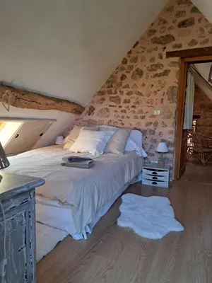 Un ou plusieurs lits dans un hébergement de l'établissement Maison la Bambine chambre nature