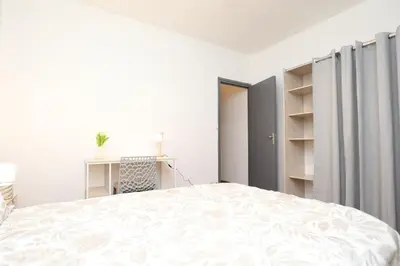 Un ou plusieurs lits dans un hébergement de l'établissement Appartement Cosy - Proche du Centre-Ville