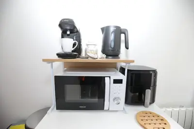 Cuisine ou kitchenette dans l'établissement Appartement Cosy - Proche du Centre-Ville