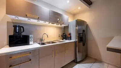 Cuisine ou kitchenette dans l'établissement Patio Jeannin
