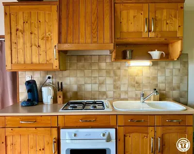 Cuisine ou kitchenette dans l'établissement Le Refuge
