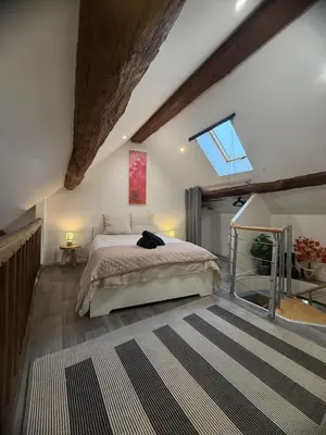 Un ou plusieurs lits dans un hébergement de l'établissement Appartement spacieux, au cœur de la ville 40 m