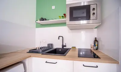 Cuisine ou kitchenette dans l'établissement Calme en plein cœur du quartier historique