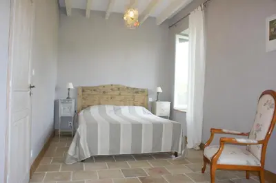 Un ou plusieurs lits dans un hébergement de l'établissement Gîte La Maison De Lucien