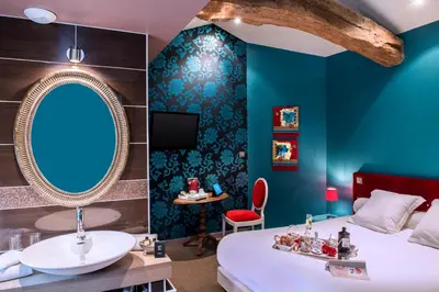 Un ou plusieurs lits dans un hébergement de l'établissement Frédéric Carrion - Cuisine, Hôtel & Spa